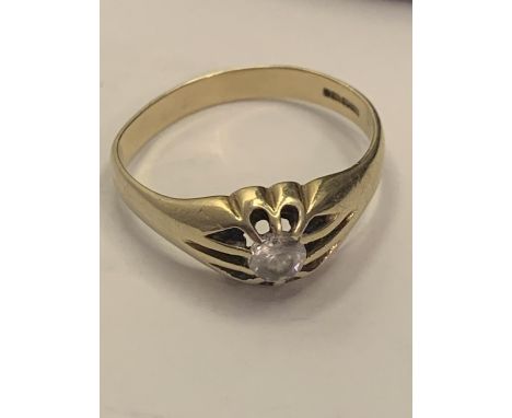 A 9 CARAT GOLD RING WITH A CLEAR STONE GROSS WEIGHT 3.8 GRAMS 