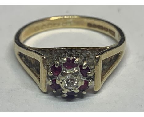 A 9 CARAT GOLD DIAMOND AND RUBY CLUSTER RING SIZE L/M 