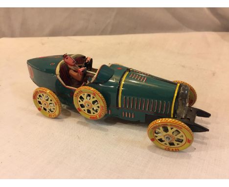 A TIN PLATE TOY CAR 