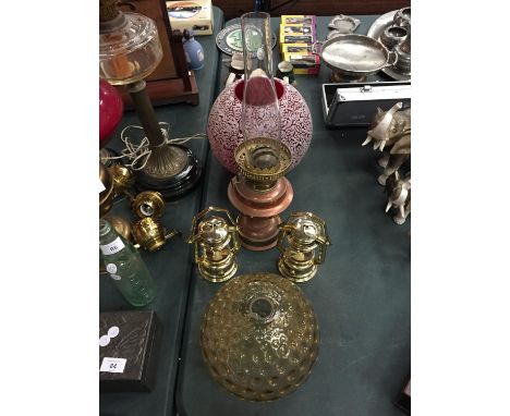 A BRASS OIL LAMP BASE PLUS TWO GLASS SHADES 