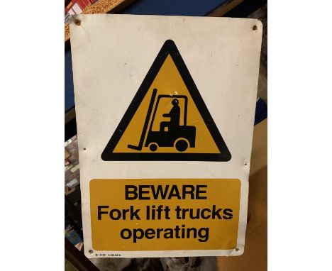A TIN BEWARE FORK LIFT TRUCKS OPERATING SIGN 