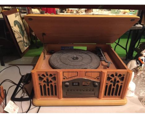 A VINTAGE STYLE MODERN CASED RECORD PLAYER INCORPORATING A CD AND A RADIO 