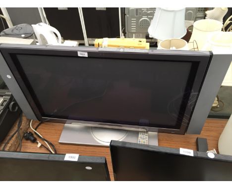 A 32" HITACHI TELEVISION WITH REMOTE CONTROL 