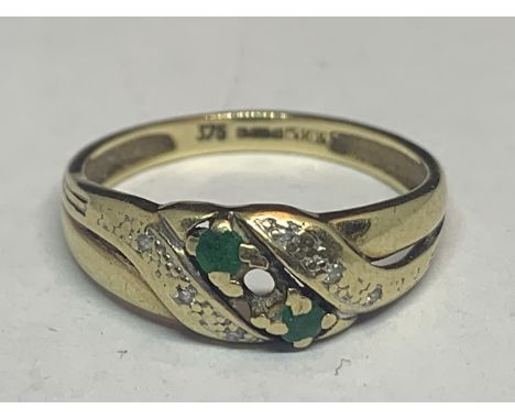 A 9 CARAT GOLD DIAMOND AND GREEN STONE CLUSTER RING SIZE N/M GROSS WEIGHT 3 GRAMS 
