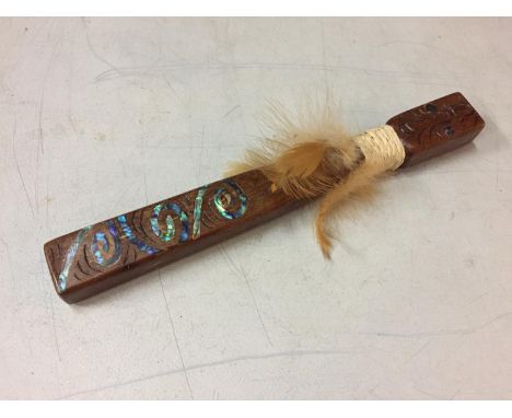 A TRIBAL STYLE STICK DECORATED WITH MOTHER OF PEARL LENGTH 25CM 