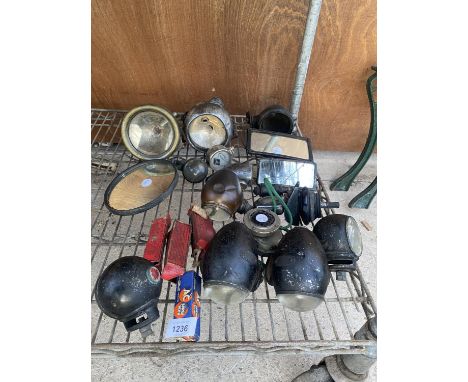 AN ASSORTMENT OF VINTAGE AUTOMOBILE SPARES TO INCLUDE LIGHTS, MIRRORS AND SPARK PLUGS ETC 