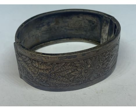 A MARKED STERLING SILVER BANGLE 