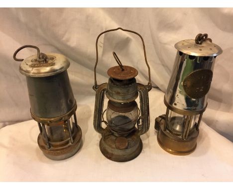 A WOLF SAFETY LAMP HEIGHT 21CM, A SAFETY LAMP MADE IN ECCLES HEIGHT 23CM AND A SMALL TILLEY STYLE LAMP HEIGHT 19CM 