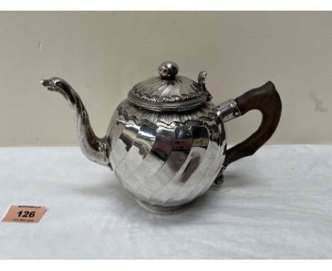 A continental silver teapot with facetted wrythen globular body and swan-neck spout. Handle broken. 5¾' high. 15ozs 12dwts ex