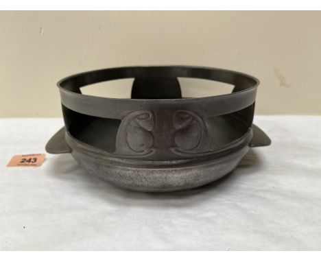 Liberty &amp; Co. An Art Nouveau bowl designed by Archibald Knox. Stamped number 0320. Glass liner lacking. 9½' wide over han
