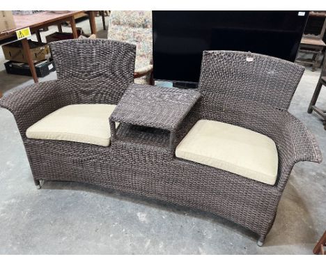 A loom style two seater conservatory sofa. 70' wide