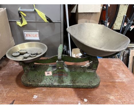 A set of weighing scales with brass weights