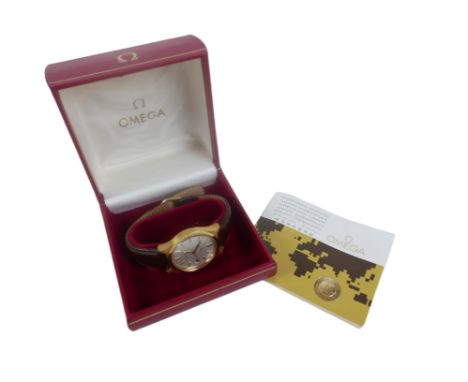 An Omega Geneve gents wrist watch, manual wind with auto date, date aperture, gold plated case, brushed silver dial, black an