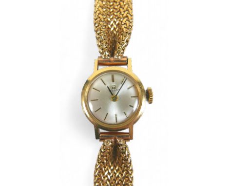 A 14 ct yellow gold Tissot ladies wristwatch on an 18ct bracelet strap, 17mm case, manual wind, 18cm long, 27gs. 