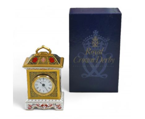 A collection of Royal Crown Derby Old Imari 1128 pattern mantel clock, Roman numeral dial, 11.7 by 7 by 18cm high, with origi
