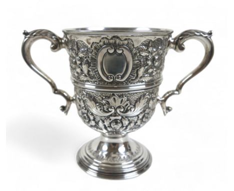 An Edward VII silver twin handle trophy cup with embossed decoration William Hutton & Sons Ltd Sheffield 1902/03, 20 by 10.5 