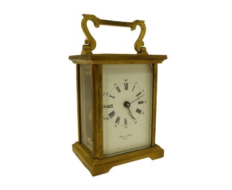 A brass carriage clock signed Bernard Freres, 8 by 6 by 14.5 cm. 