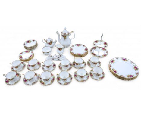 A Royal Albert country rose tea dinner  service, six setting with twelve tea cups and saucers cruet and cake stand, 54 pieces