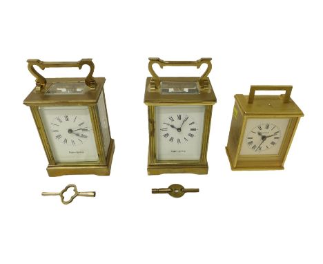 Two brass carriage clocks and an alarm clock, carriage clocks measure 8 by 6 by 15cm high with handle up (3) 