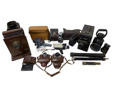 A collection of cameras, cine camera, and a collection of brass and copper items including copper scales, and two lamps. (2 b