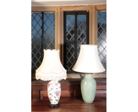 A GREEN CELADON VASEwith carved decoration, converted to a table lamp, 63cm high including the shade, fitted for electricity;