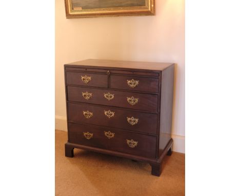 A GEORGE II MAHOGANY CADDY TOP CHEST OF DRAWERS with brushing slide over two short and three long graduated drawers, all appa