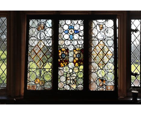 A LEADED LIGHT WINDOW&nbsp;in three sections, incorporating panels of stained glass, 15th century and later, 130cm x 143.5cm 
