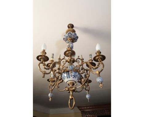A CONTINENTAL BRASS AND "DELFTWARE" CHANDELIER with two registers of four scrolling branches, with a simple suspension loop, 