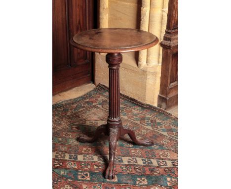 A LATE GEORGE II MAHOGANY TRIPOD TABLE ensuite with the previous tables, but with a later top, on a fluted column and an acan