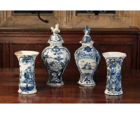 A DUTCH DELFTWARE VASE AND COVERwith a lion finial, the moulded cartouche-shaped body decorated with flowers in a garden and 