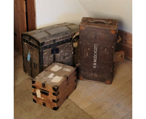 A COLLECTION OF LUGGAGE&nbsp;including an iron-bound sea chest, with a domed lid opening to a lined interior, 61cm x 70cm; a 