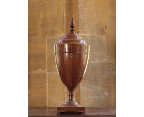 A GEORGE III MAHOGANY CUTLERY URN circa 1785, of Hepplewhite design, inlaid with chequered stringing and the rising lid with 