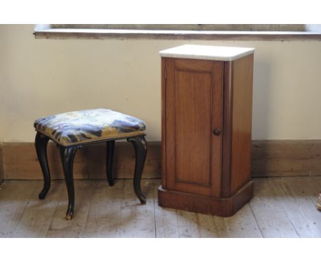 A VICTORIAN BEDSIDE CUPBOARDwith a marble top, over a single panelled door, on a plinth base; a Victorian stool with a floral