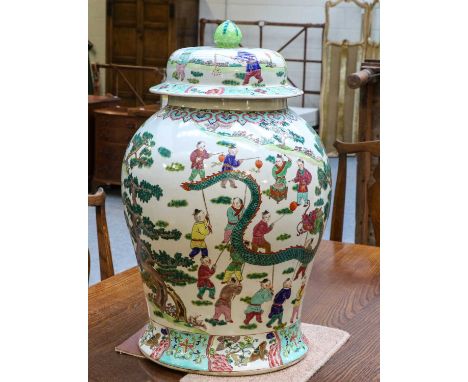 An impressive 20th century Chinese porcelain baluster floor vase and cover, painted in coloured enamels with a festive celebr