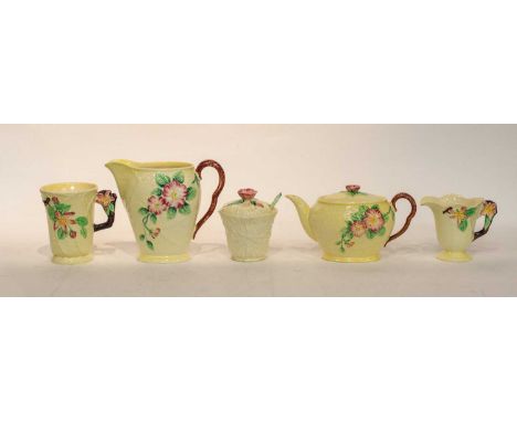 A Carlton Ware breakfast service, yellow ground decorated with flowers, including: six cups and saucers, preserve pots and co