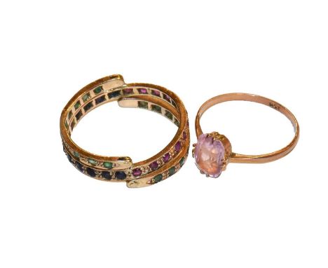 A ruby, emerald and sapphire flip ring, unmarked, finger size S1/2; and a pink stone ring, stamped '9CT', finger size NCondit