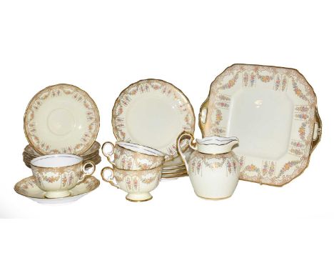 A 19th century Copeland Spode Brownlow pattern part tea service, gilt rimmed with floral decoration on a cream ground (one tr