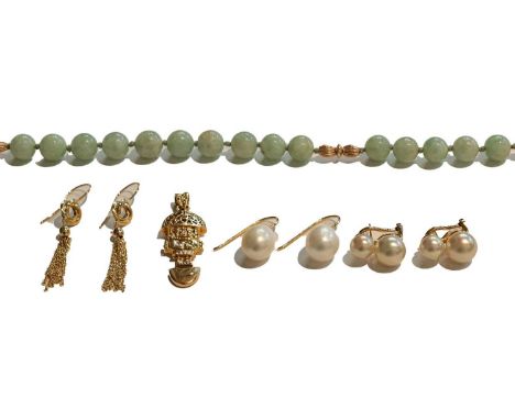A jade bead necklace, clasp stamped '14K585', length 64cm; a pendant stamped '14K', length 4.5cm; a pair of drop earrings, st