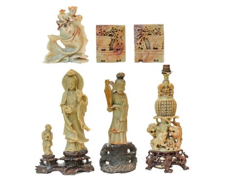 A group of Oriental soapstone carvings, including: a figure of Guanyin, a table lamp, bookends, etc, tallest 37cm