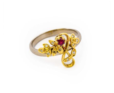 An 18 carat gold ruby and diamond ring, the yellow floral swag set throughout with eight-cut diamonds and a round cut ruby, i