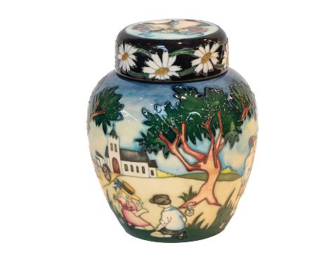 Modern Moorcroft pottery: a ginger jar and cover by Nicola Slaney, decorated with children playing, with a church in the back