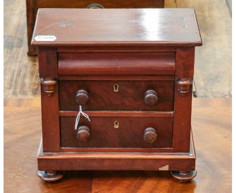 A Victorian mahogany miniature Scotch chest, 25cm by 13cm by 25cmCondition report: The top has significant superficial marks.