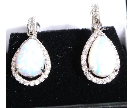 A pair of 925 white metal silver and opal drop earrings