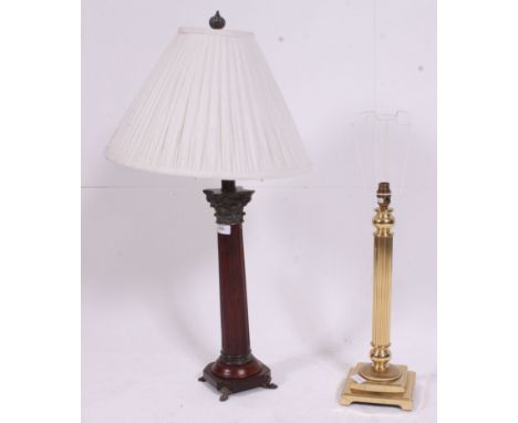 A good quality neo-classical wooden and copper caubel mounted table lamp raised on brass paw feet. Together with a brass cori
