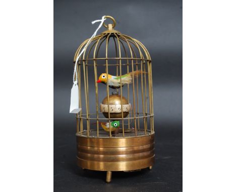 An antique style automaton brass cased clock in the form of a bird cage