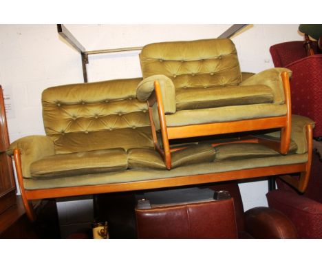 A retro wooden framed 1960's three seat sofa and matching chair in the manor of G-Plan