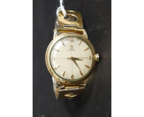 A vintage gentlemans Omega Automatic wristwatch having baton numerals, the dial marked Omega Automatic - Swiss Made. Set on a