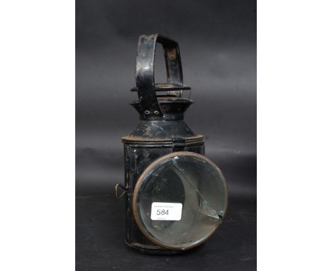 An early 20th century railway lamp / lantern with glass lens to front, rotating red and blue panels to interior. No makers ma