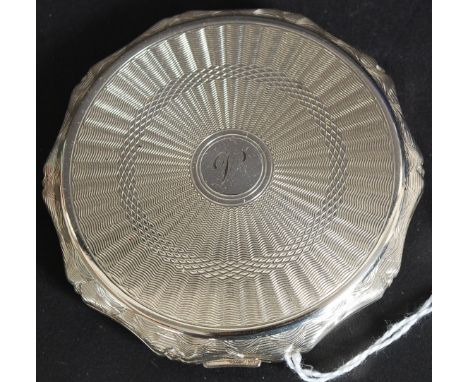 A fabulous 20th century hallmarked silver Kigu ladies circular powder compact.