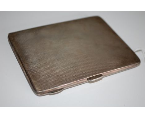 A large hallmarked silver engine turned cigarette case marked for J.G Ltd,  Birmingham date letter T. Total Weight 140g